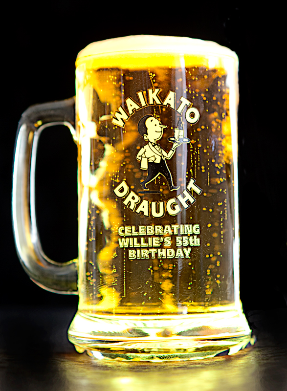 Image of filled beer glass with writing on Waikato draught celebrating willies 55 the birthday